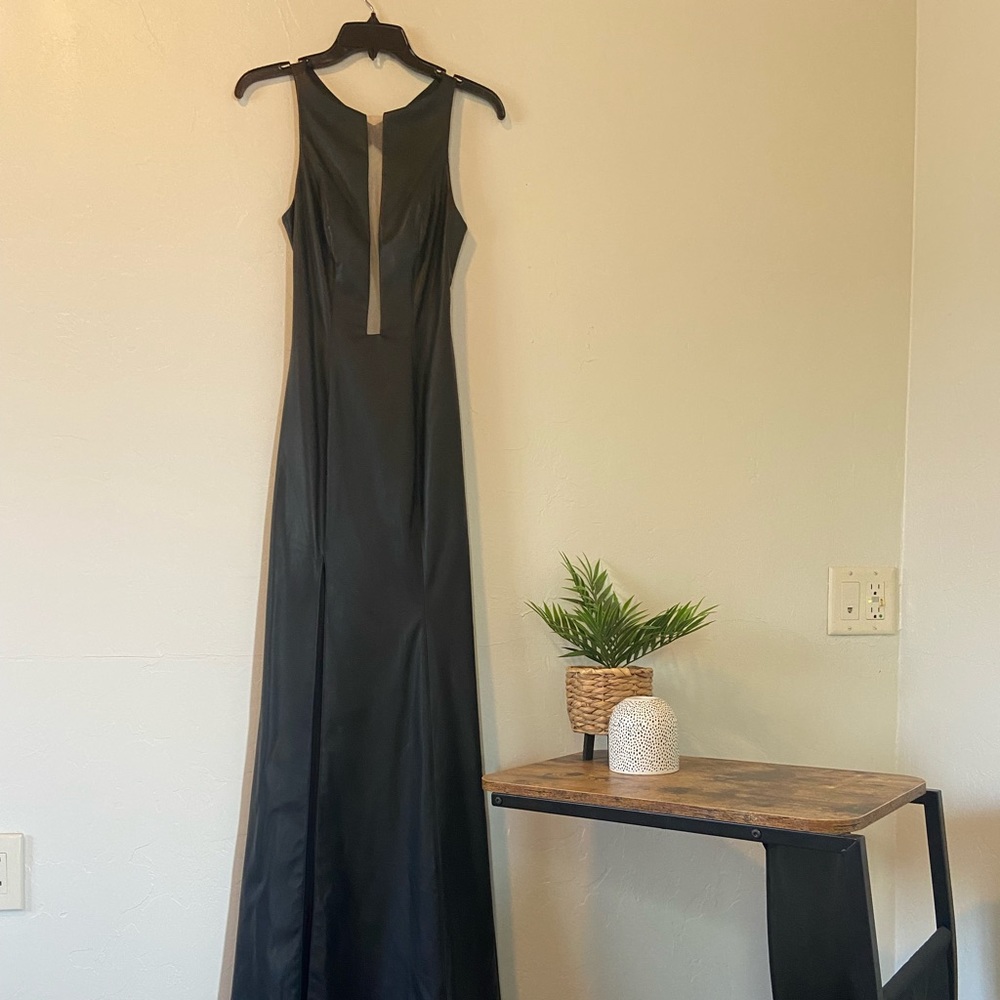 Black leather gown with open back. Worn twice in perfect condition!